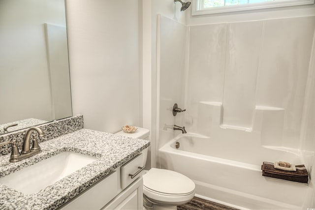 full bathroom with wood-type flooring, vanity, toilet, and shower / tub combination