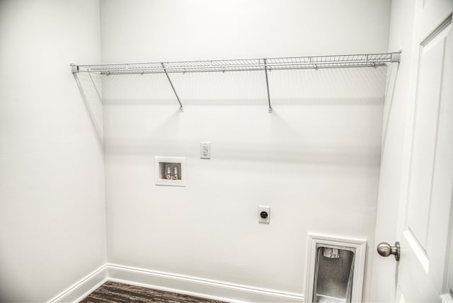 washroom featuring washer hookup, electric dryer hookup, and dark wood-type flooring