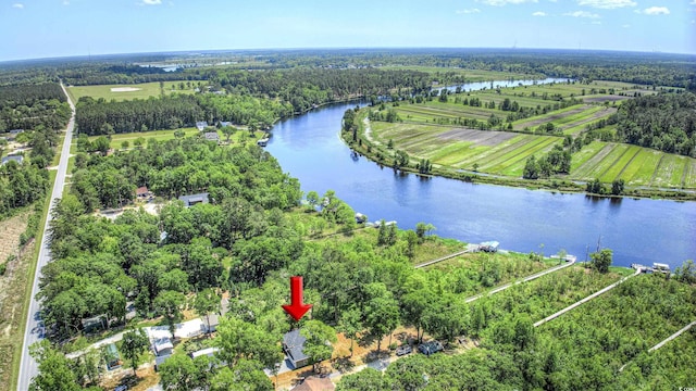 aerial view with a rural view and a water view