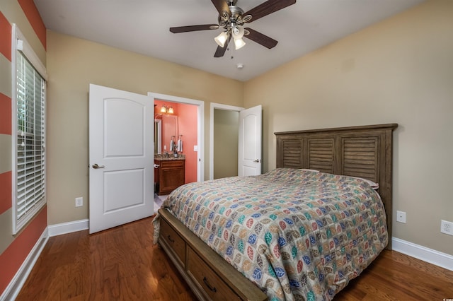 bedroom featuring dark wood-type flooring, ceiling fan, and ensuite bath