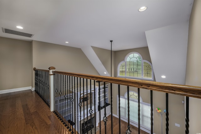 hallway with dark hardwood / wood-style flooring