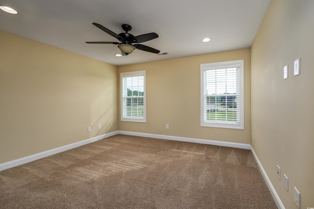 unfurnished room with carpet and ceiling fan