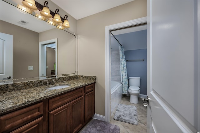 full bathroom featuring vanity, tile patterned floors, toilet, and shower / bath combo with shower curtain