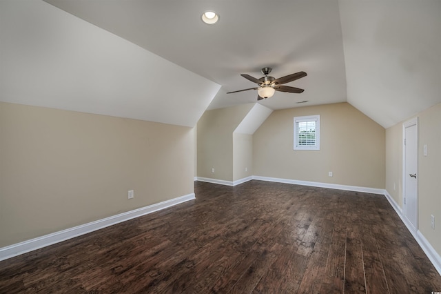 bonus room with dark hardwood / wood-style flooring, vaulted ceiling, and ceiling fan