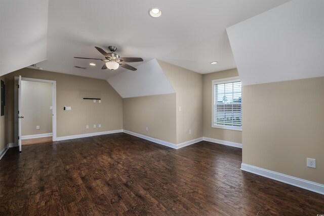 bonus room with ceiling fan, dark hardwood / wood-style floors, and lofted ceiling