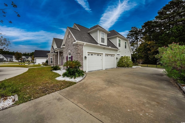 view of property exterior featuring a garage and a lawn