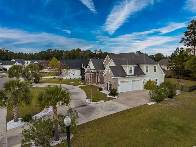 view of front of house with a garage and a front yard