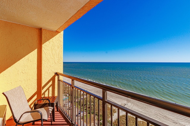 balcony featuring a water view