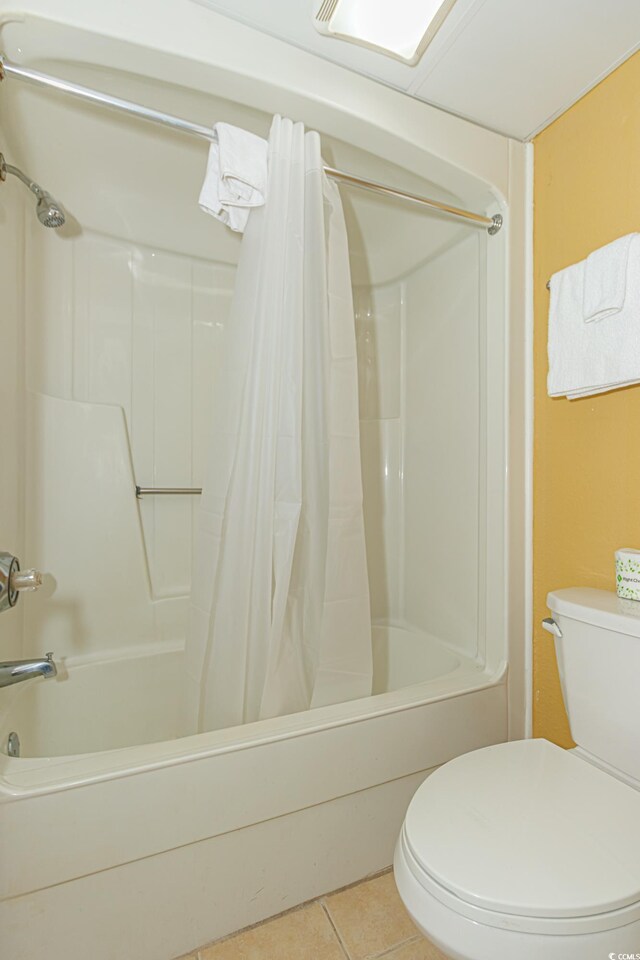 bathroom featuring tile patterned flooring and toilet