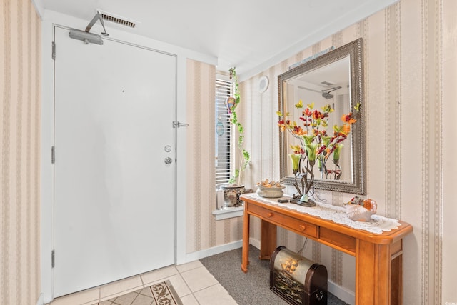 entrance foyer featuring light tile patterned flooring