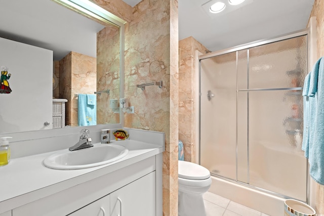 full bathroom with tile patterned floors, toilet, vanity, and a shower stall