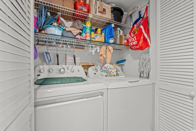 clothes washing area featuring independent washer and dryer