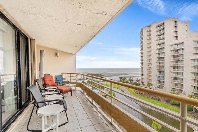 balcony featuring a water view