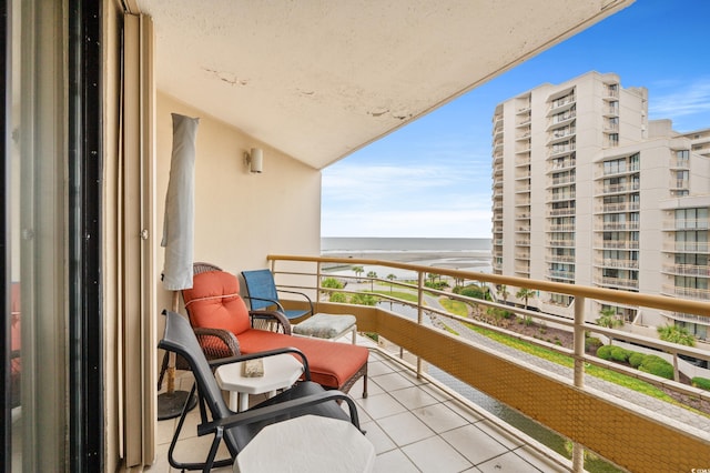 balcony featuring a water view