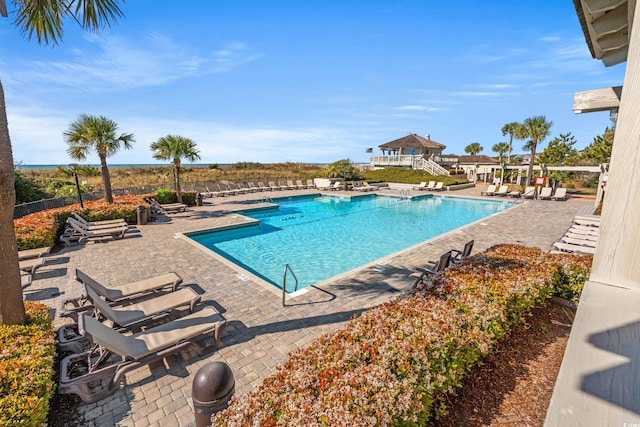 view of swimming pool with a patio area