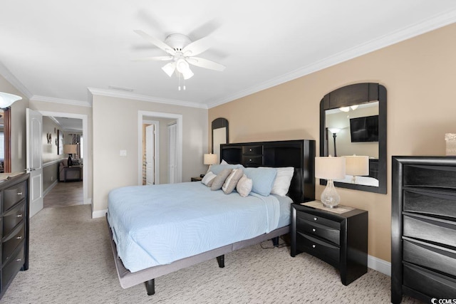 bedroom featuring ceiling fan, crown molding, and light carpet