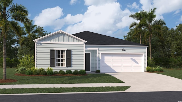 view of front of house with a garage and a front yard