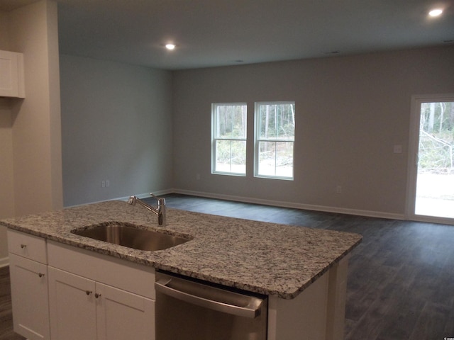 kitchen with white cabinetry, dishwasher, sink, and light stone countertops