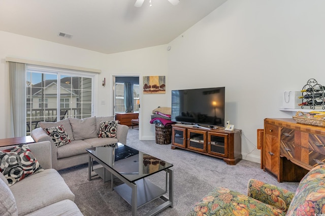 living room featuring light carpet, ceiling fan, and lofted ceiling