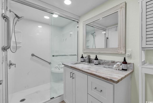 bathroom featuring vanity and walk in shower