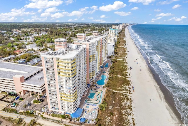 bird's eye view with a water view and a view of the beach