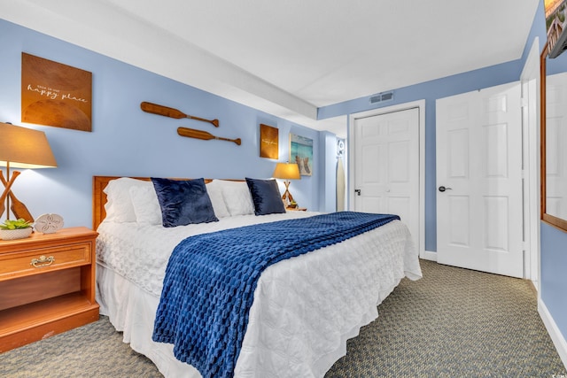 carpeted bedroom featuring a closet