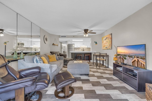 living room featuring ceiling fan