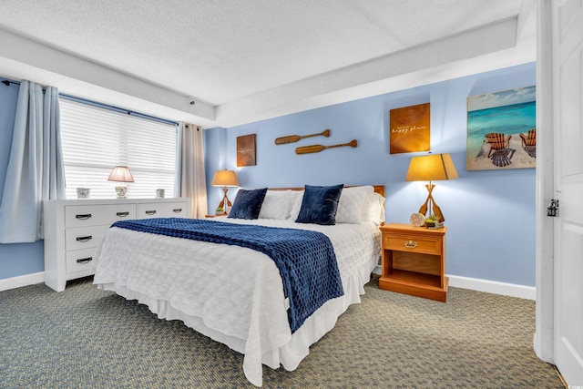 carpeted bedroom with a textured ceiling