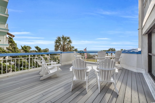 wooden terrace with a water view