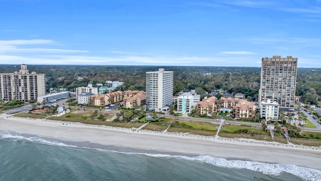 bird's eye view featuring a view of the beach and a water view