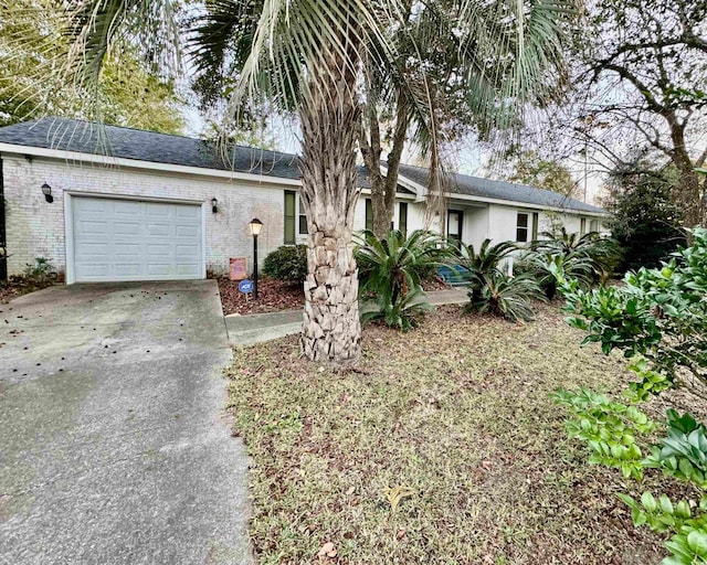 single story home featuring a garage