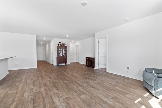 unfurnished living room with light hardwood / wood-style flooring