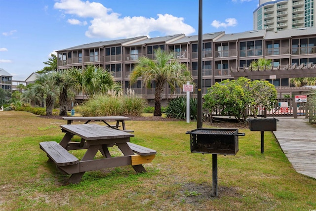 view of home's community with a lawn