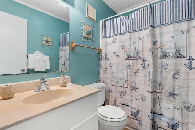 bathroom with vanity, a shower with shower curtain, toilet, ornamental molding, and a textured ceiling