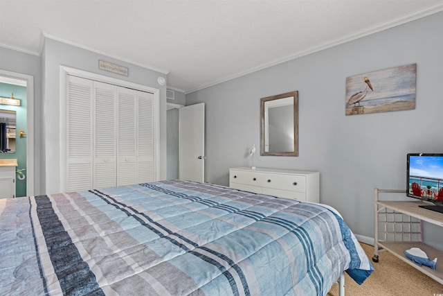 carpeted bedroom with a closet and crown molding