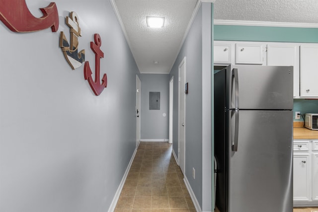 hall featuring electric panel, a textured ceiling, and ornamental molding