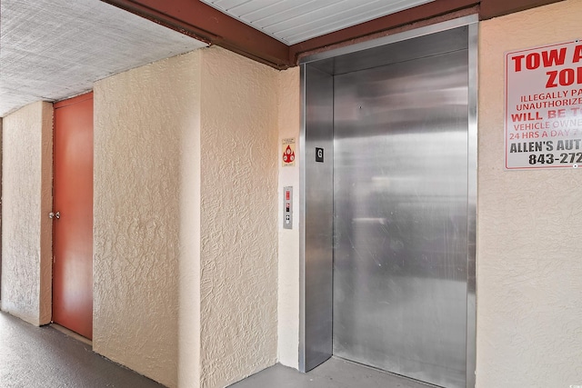 entrance to property featuring elevator