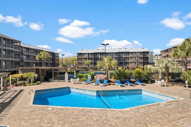 view of swimming pool with a patio