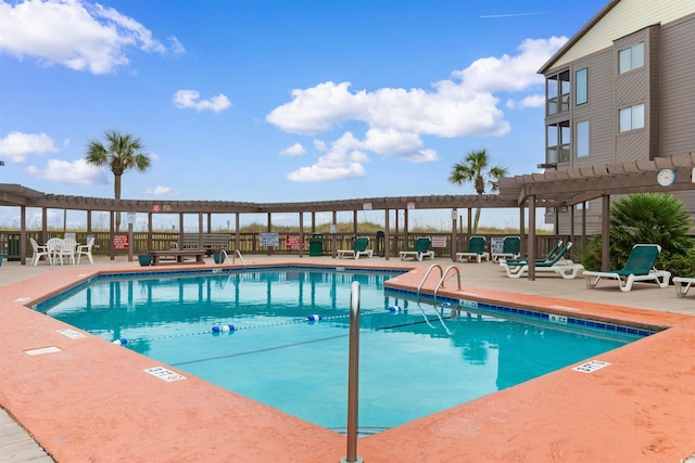 view of swimming pool with a patio area and a pergola