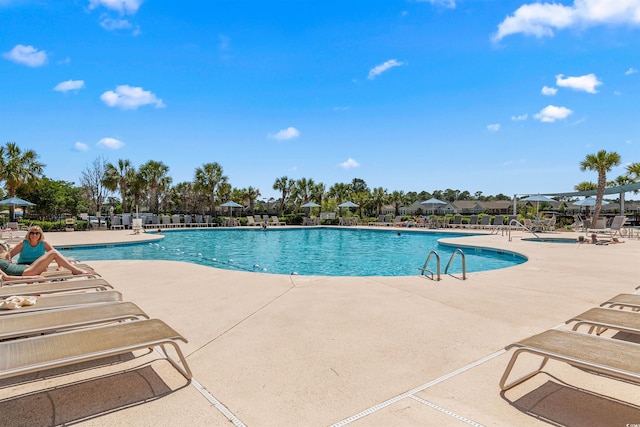 view of swimming pool featuring a patio area