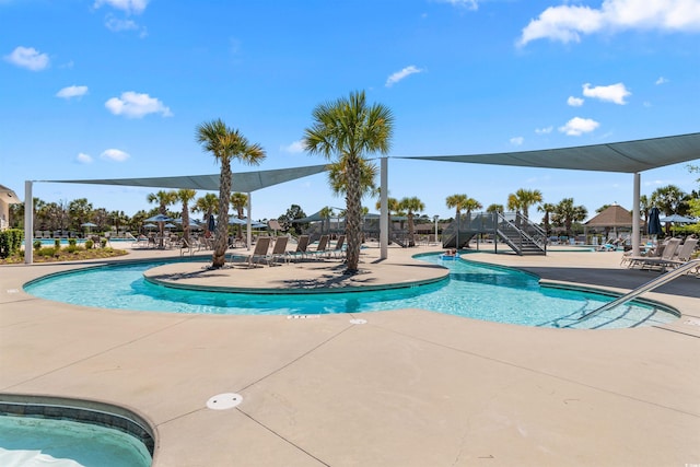 view of swimming pool featuring a patio area