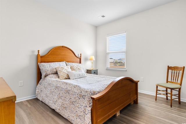 bedroom featuring hardwood / wood-style flooring