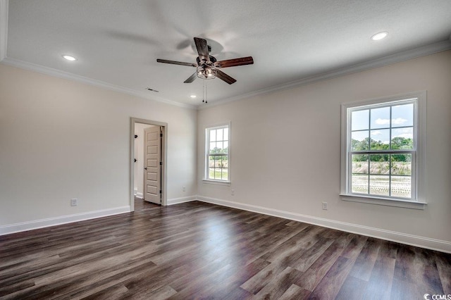 unfurnished room featuring dark wood finished floors, visible vents, baseboards, ceiling fan, and crown molding