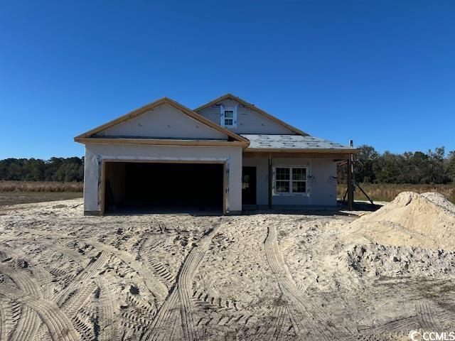 property in mid-construction with a garage