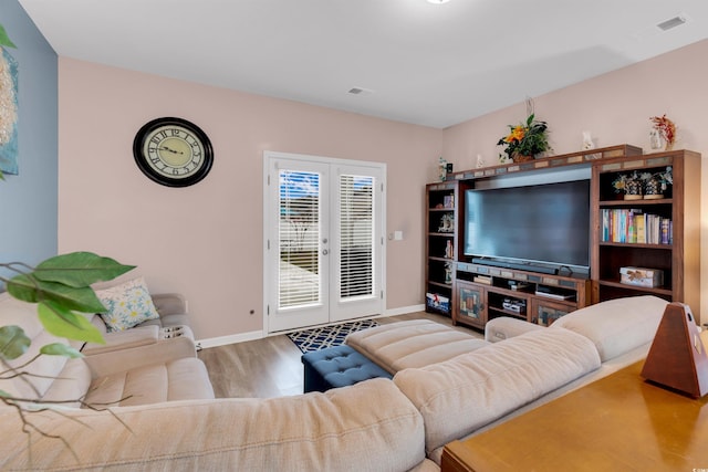 living room featuring hardwood / wood-style floors and french doors