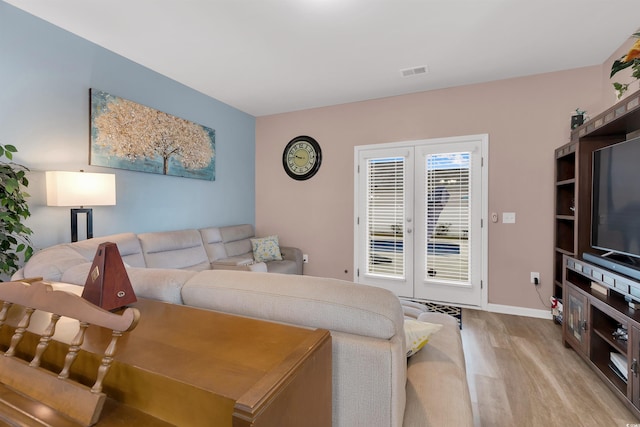 568 Affinity Dr, Myrtle Beach, SC 29588 - living area featuring french doors, light wood-style floors, and baseboards