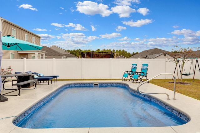 view of swimming pool with a patio