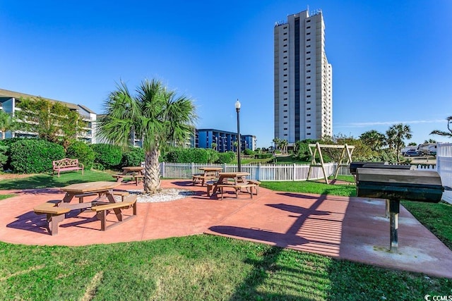 view of property's community with a patio