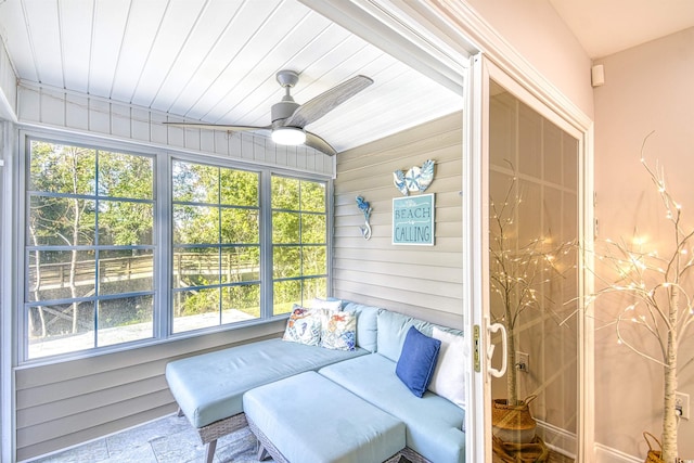 sunroom / solarium featuring ceiling fan, wooden ceiling, and vaulted ceiling