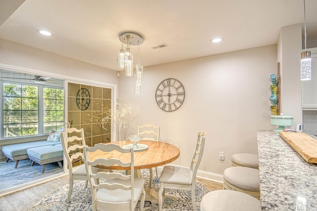 dining area with wood-type flooring